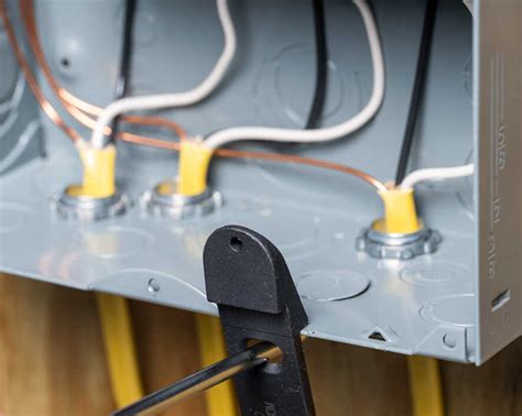 wire entering a metal weatherproof box|metal electrical box knockout.